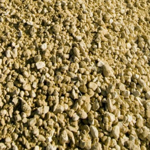 Close-up of a pile of small yellowish base gravel
